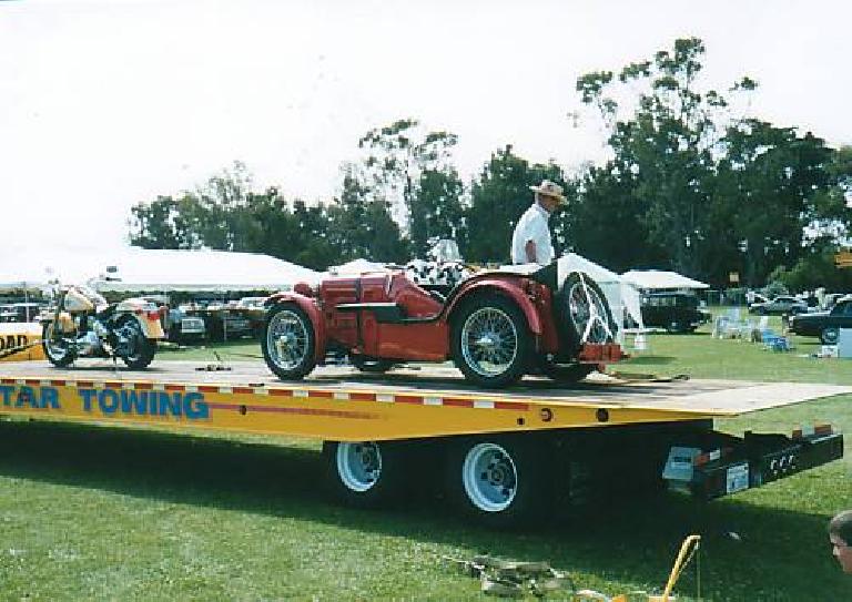 MG Midget on a trailer with a British motorcycle.