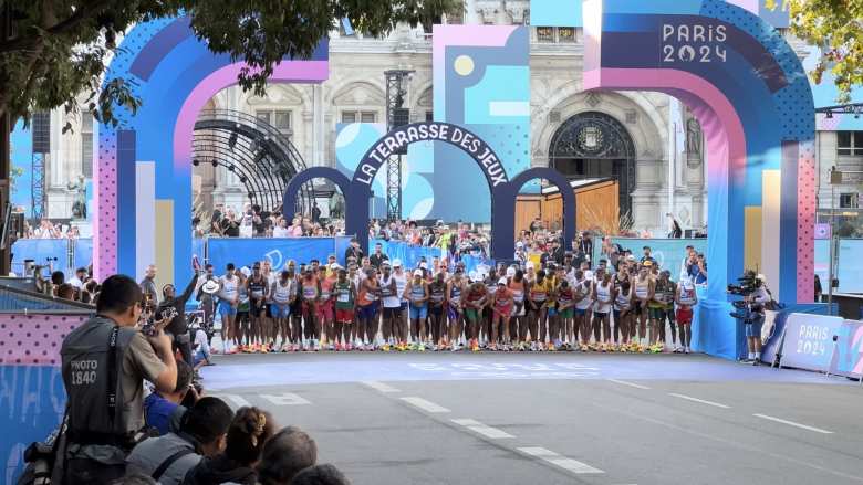 The runners at the start line of the Olympics men's marathon in front of L'Hôtel de Ville in Paris.