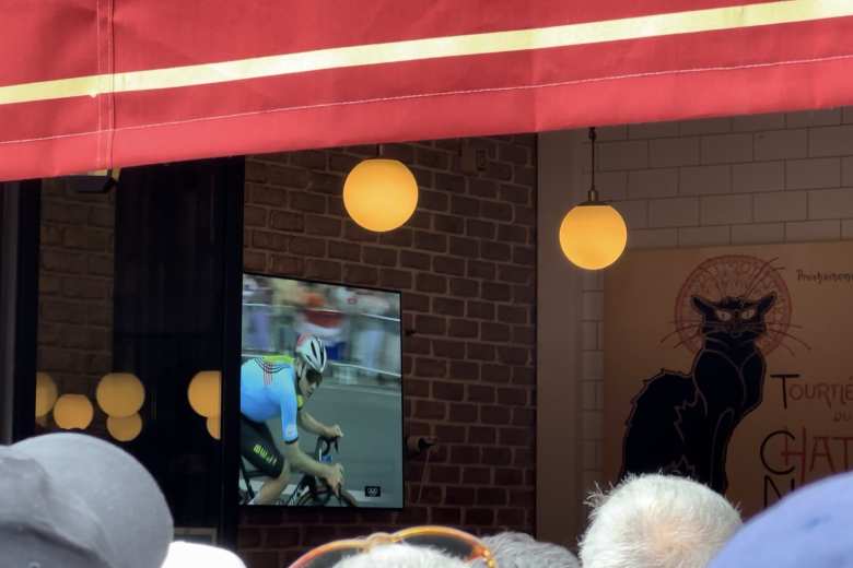 Watching Remco Evenepoel take Olympic gold on a TV at the Le Chat Noir bar, where I was standing nearby.