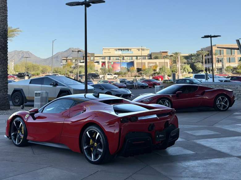 One thing is not like the others: a Tesla Cybertruck among a sea of Ferraris and other supercars.