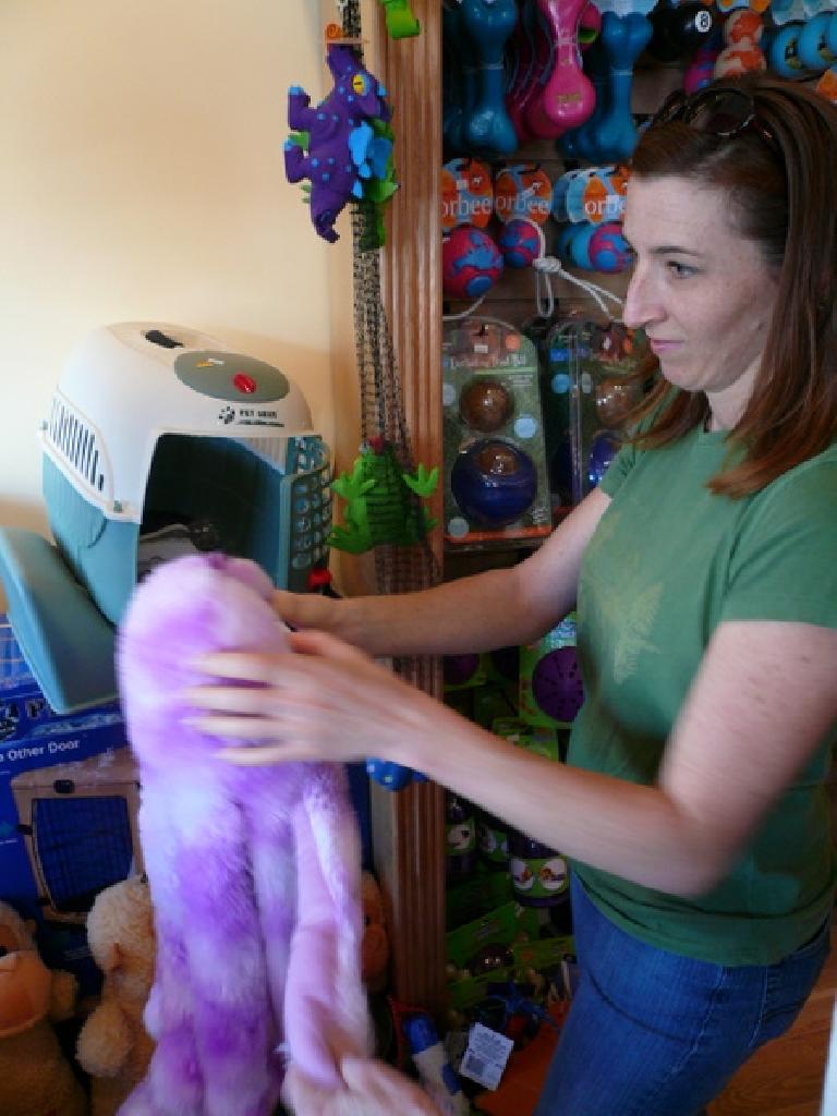 Tori holding an octopus in a pet shop, probably thinking, "this is funny looking!"