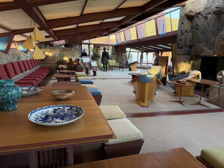 The Garden Room was as an early example of open concept design, blending a grand piano, intimate dining areas, and expansive built-in seating into a single light-filled space that invites the desert landscape indoors. The Garden Room was as an early example of open concept design, blending a grand piano, intimate dining areas, and expansive built-in seating into a single light-filled space that invites the desert landscape indoors.