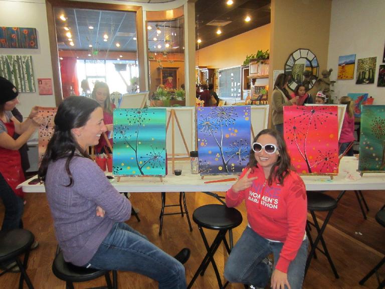 Lisa finishes up her painting while Tori looks at Raquel and her big glasses.