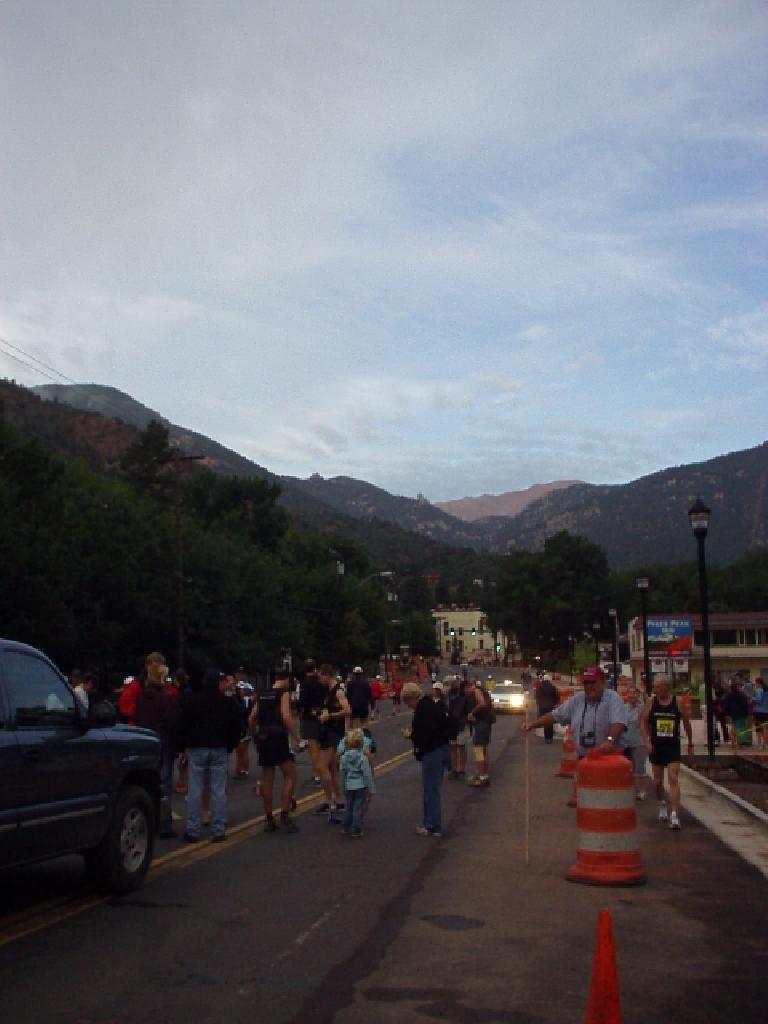 [Mile 0, 6:47 a.m.] The sun rose over Pikes Peak with reddish colors before the race.