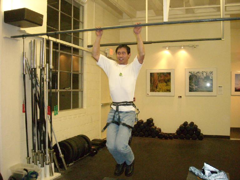 Felix Wong doing weighted pull-ups.