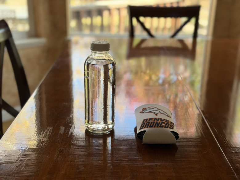 I got another glass kombucha bottle—this one clear—and Denver Broncos koozie for use in my other car.