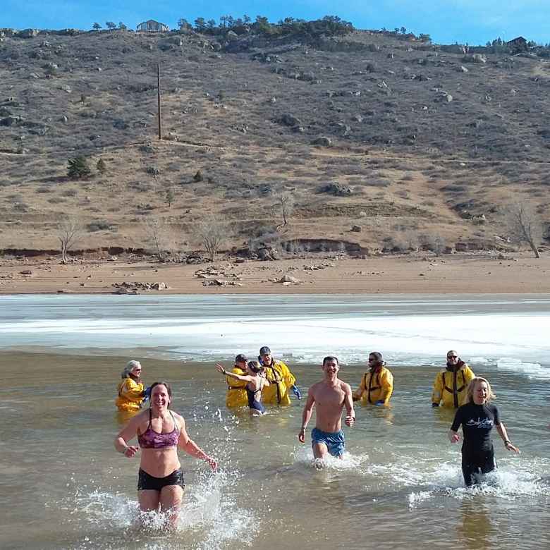 Jennifer, Felix and Emily emerging from the Horsetooth Reservoir at the 2019 Polar Bear Plunge.