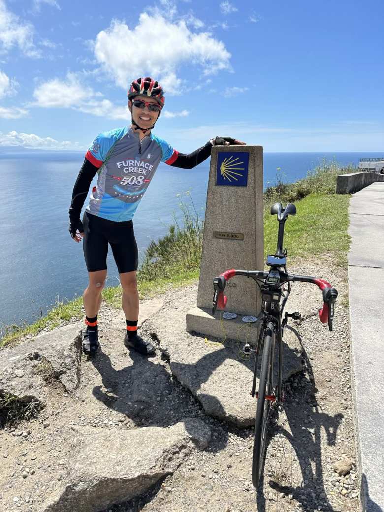 Felix Wong and his LItespeed Archon C2 bicycle at the 0.0 KM marker of the Camino Fisterra.