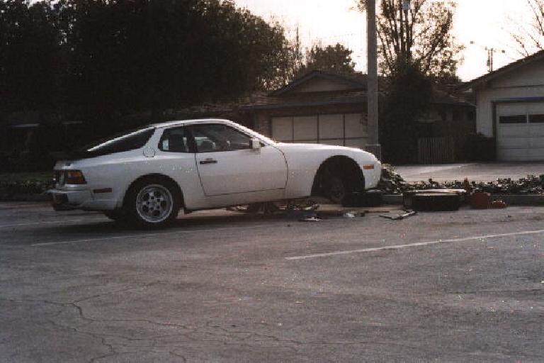 white Porsche 944 Turbo with front on jackstands