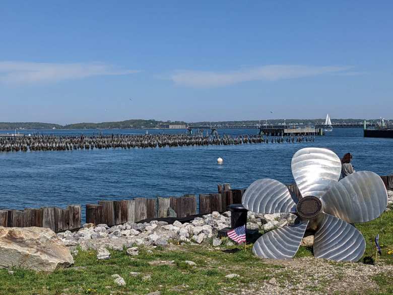 A propeller and U.S. flag by the harbor in downtown Portland, Maine.