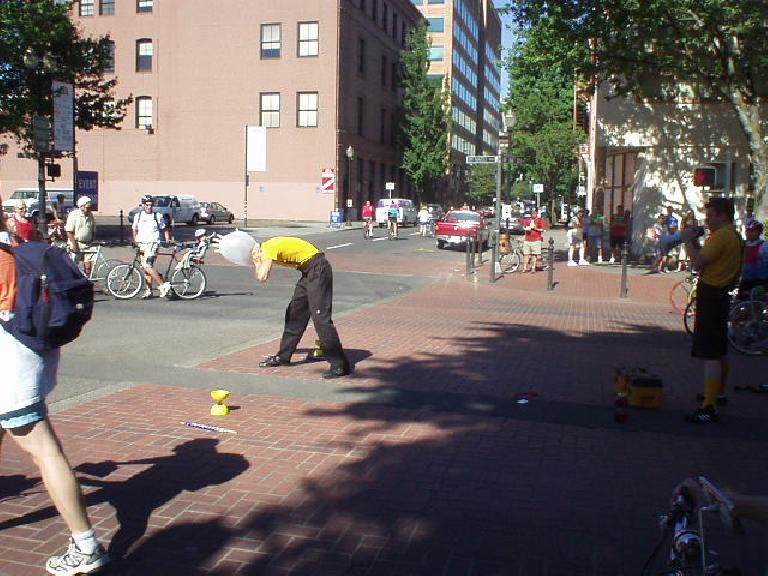 For the annual Bite of Oregon festival, these two young gentlemen were sent out to do some stunts (like juggle flames) to advertise the Bite of Oregon.  As his last stunt, this guy blew up a latex glove around his head until it burst.