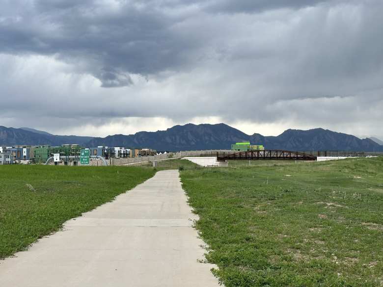 I did extra miles on the US-36 Bikeway Trail to turn the 300km brevet into a double century. Storm clouds gathered above the Flatirons of Boulder just as I about to finish.