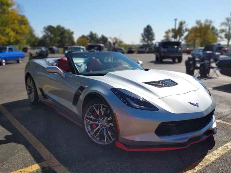 A silver C7 Corvette convertible.