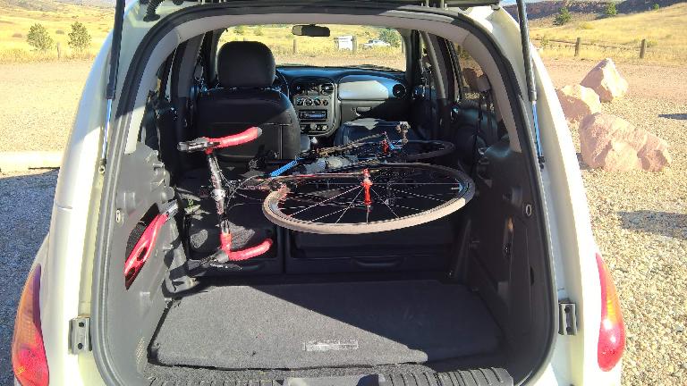 With the passenger and rear seats folded down, the PT Cruiser can carry a road bike with both wheels still attached.
