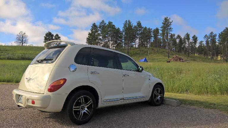 Cool Vanilla 2005 Chrysler PT Cruiser, blue tent, pine trees, Chadron State Park.