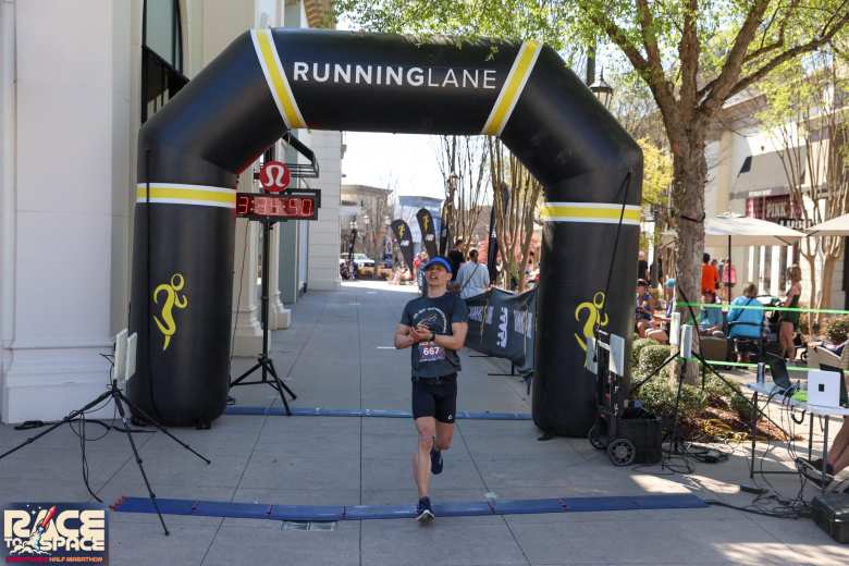 Felix Wong one second after crossing the finish line of the Race to Space Marathon in Huntsville, Alabama.