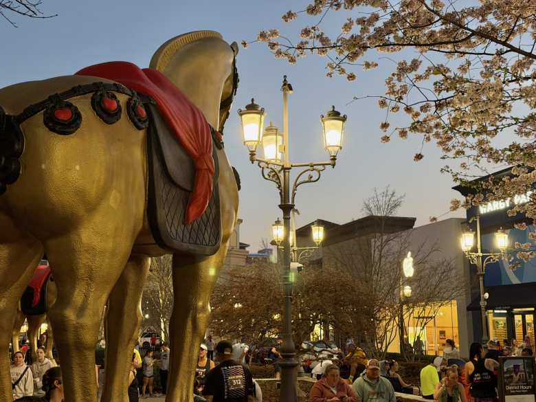 A horse statue looking at the Apple Store in Bridge Street Town Centre, Huntsville, Alabama.
