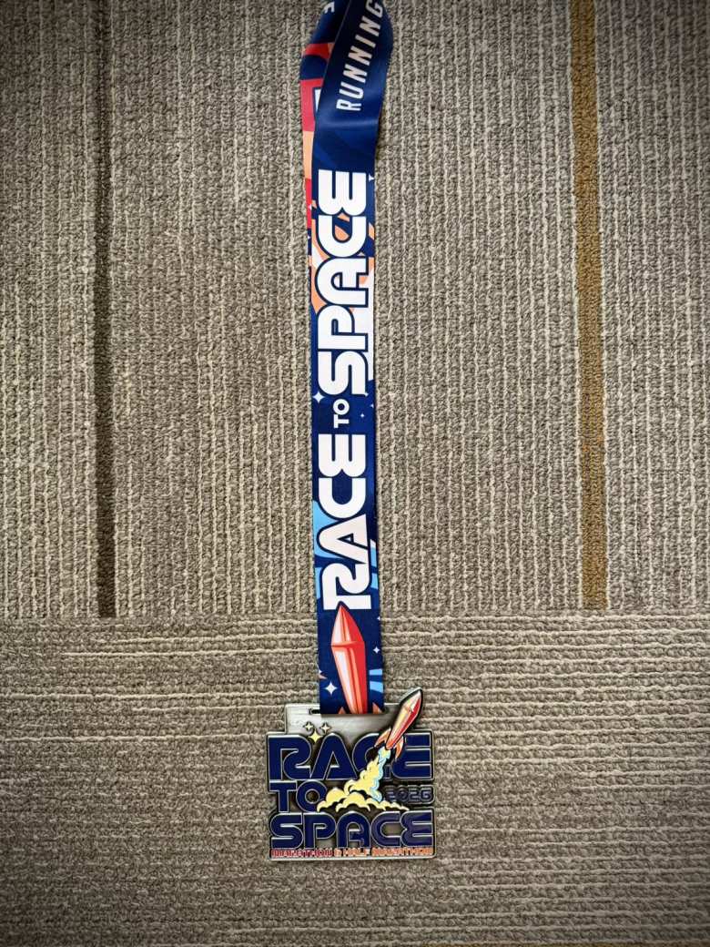 The Race to Space finisher's medal.