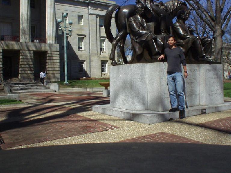 Felix Wong with a statue of Andrew Jackson.