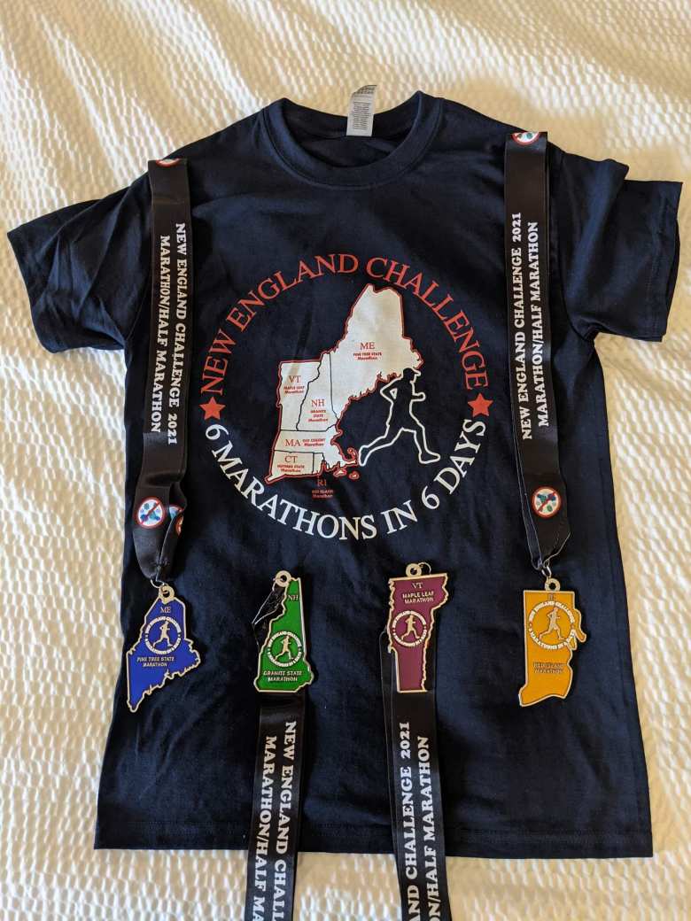 Finisher medals from Maine, New Hampshire, Vermont, and Rhode Island. I didn't run Massachusetts or Connecticut because I had run marathons in those states already.