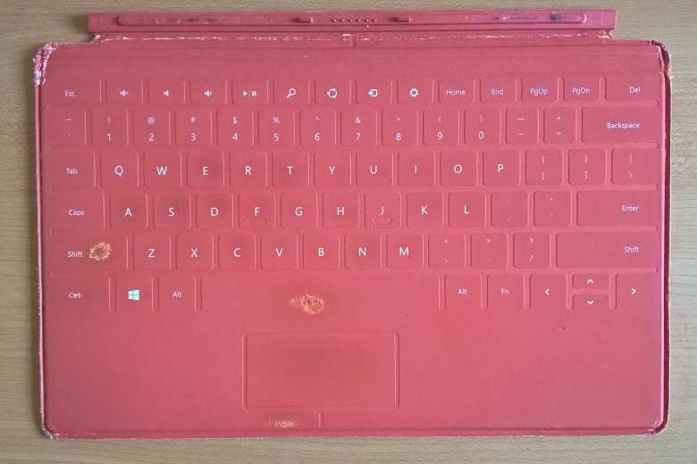 The red keyboard of my Microsoft Surface RT was well-weathered after three years of daily use and failed cleaning attempts.