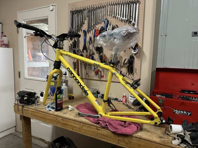 Restoring the frame of my 1996 Cannondale F700 entailed priming bare spots and mixing paint to match the correct shade of yellow.