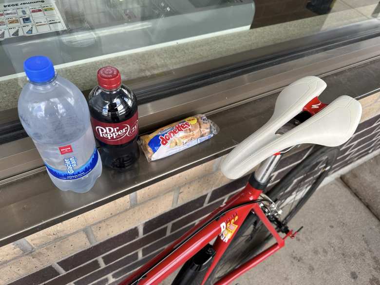 I stopped by a Kum & Go convenience store in Loveland to buy water, a Dr. Pepper, and some mini-donuts. I usually eat clean, but I need simple carbs during long bike rides like these.