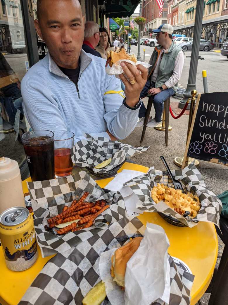 Will eating a burger outside Jack Brown's Beer & Burger Joint in Roanoke, Virginia.