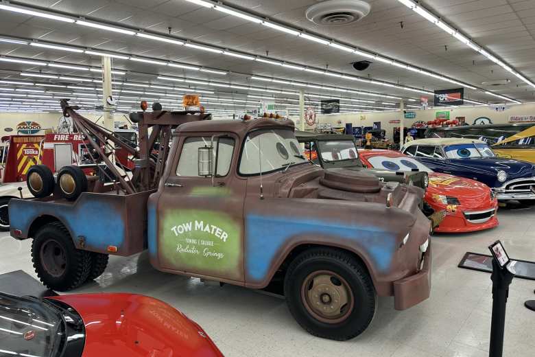 A 1955 Chevy made to look like Tow Mater, a Willys Jeep made to look like Sarge, and a car made to look like Lightning McQueen from the animated movie Cars. A 1955 Chevy made to look like Tow Mater, a Willys Jeep made to look like Sarge, and a car made to look like Lightning McQueen from the animated movie Cars.