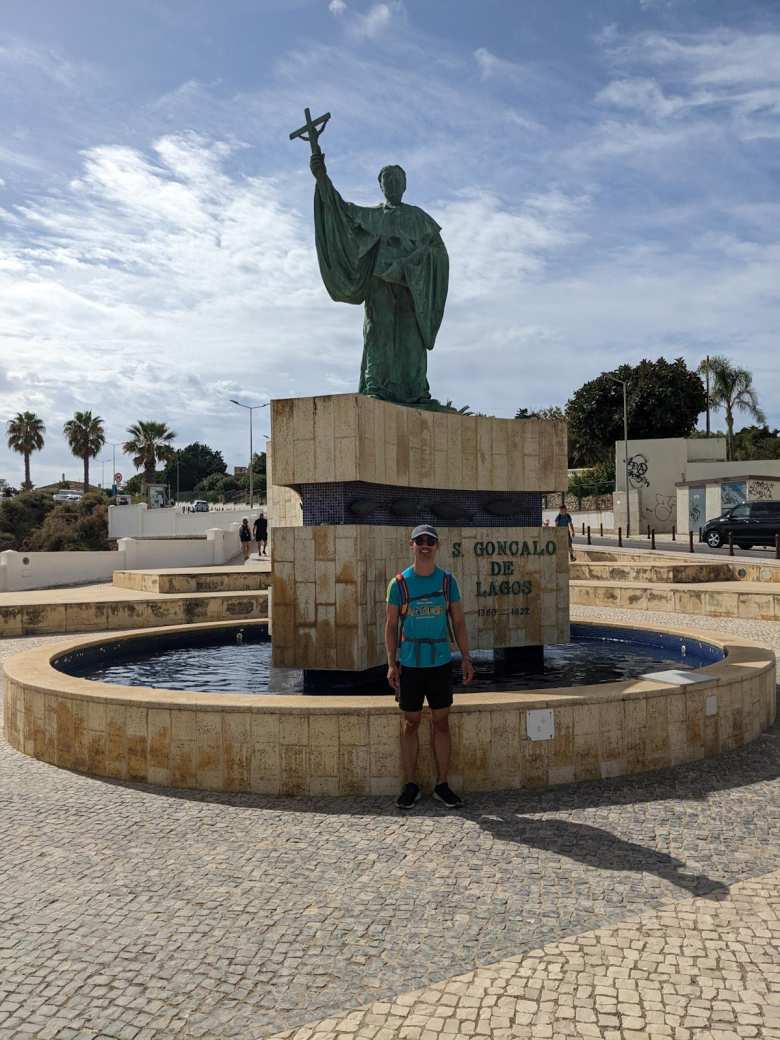 Felix in front of the statue of S. Gongalo de Lagos.