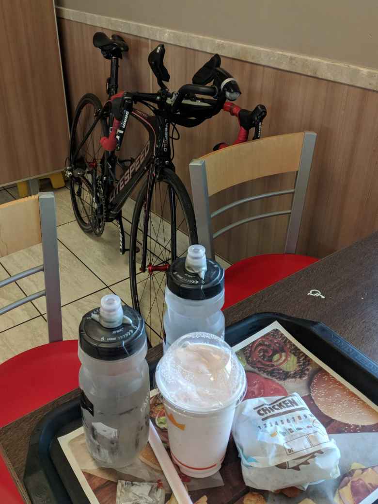 Mile 142: My Litespeed Archon C2 inside a Burger King in Longmont, where I ordered a milkshake and a chicken sandwich before heading back towards Fort Collins.