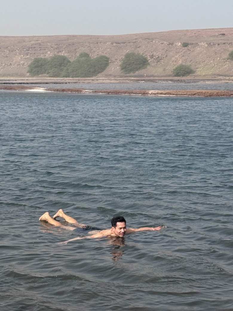 Felix floating in a salt pond at Pedra de Lume.