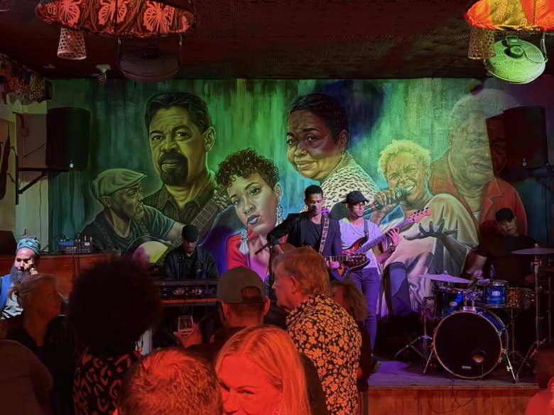 Lizender Medina singing and playing the guitar inside Buddy Bar in Santa María, Sal.
