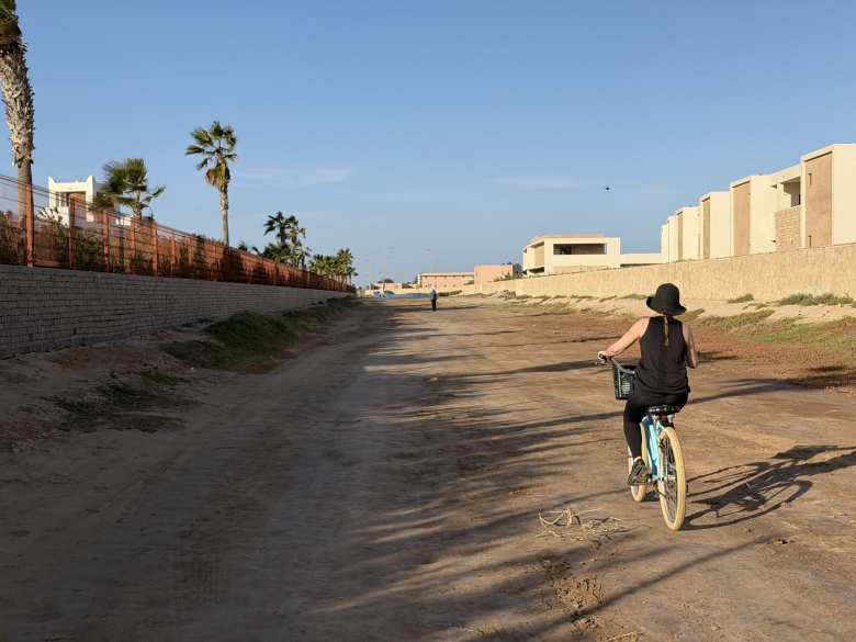 Andrea riding a beach cruiser bike that we borrowed from the Hilton Resort.