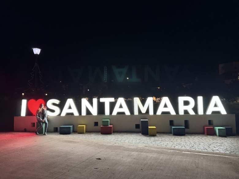 Andrea in front of the I Love Santa Maria sign in Santa Maria, Sal, Cabo Verde.