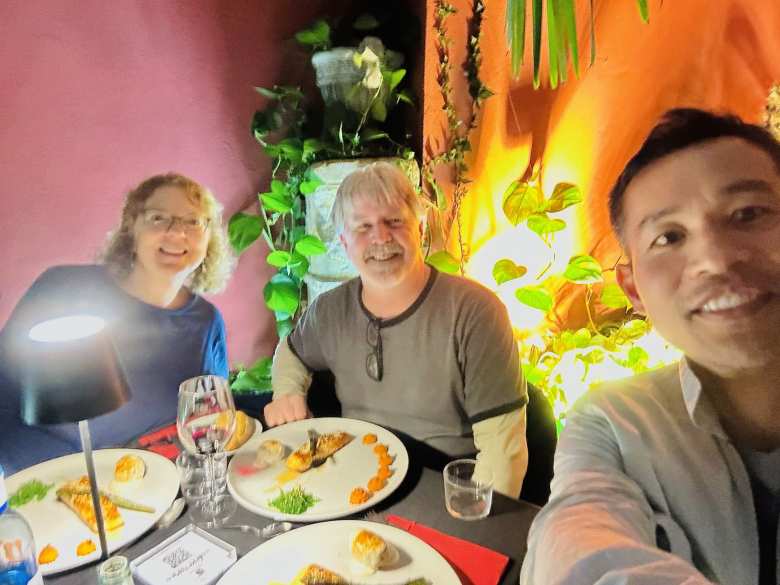 Karla, Scott, and Felix having dinner in a restaurant in Salamanca.