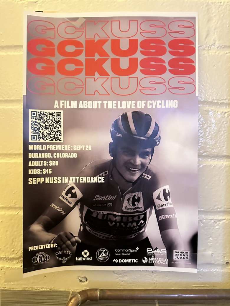 A flyer for "GC Kuss"—a documentary flyer about Durango's own Sepp Kuss winning the 2023 Vuelta a España—inside the bathroom at 11th Street Station.