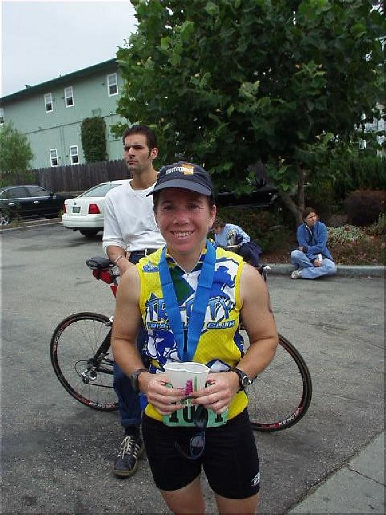 In fact, she ended up finishing 8th in her age group out of 103 women!  Here she is, all smiles with her medal around her neck and cup of Gatorade in hand.  A great day for a great gal!