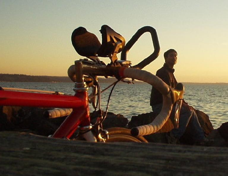 Canny looks on as Felix Wong enjoys a sunset at Saltwater State Park.