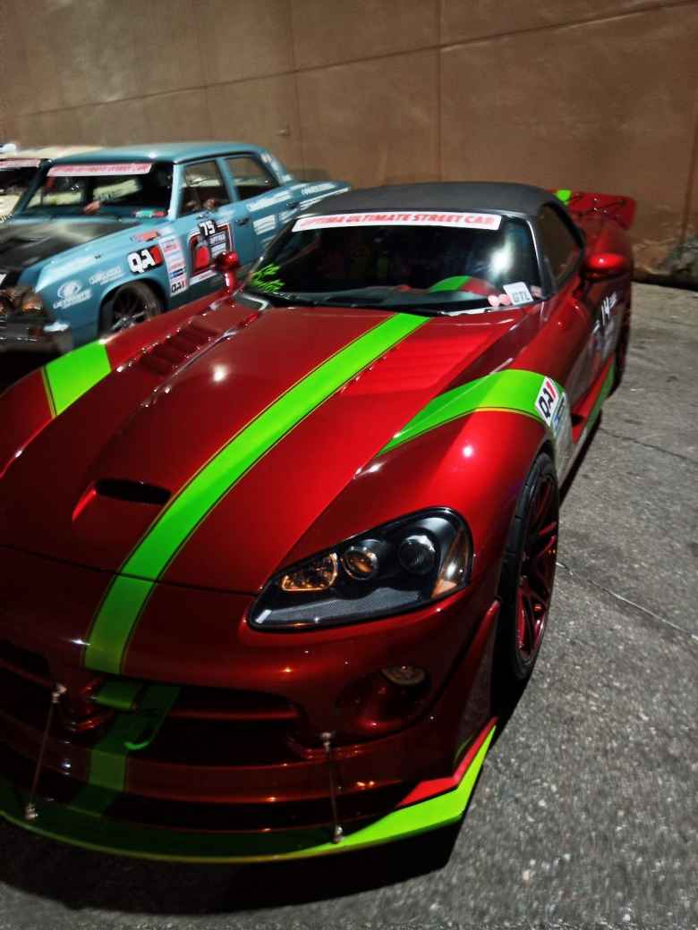 A red Dodge Viper with green stripes.