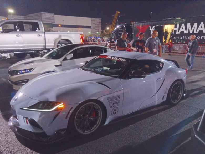 A modified white Toyota Supra.