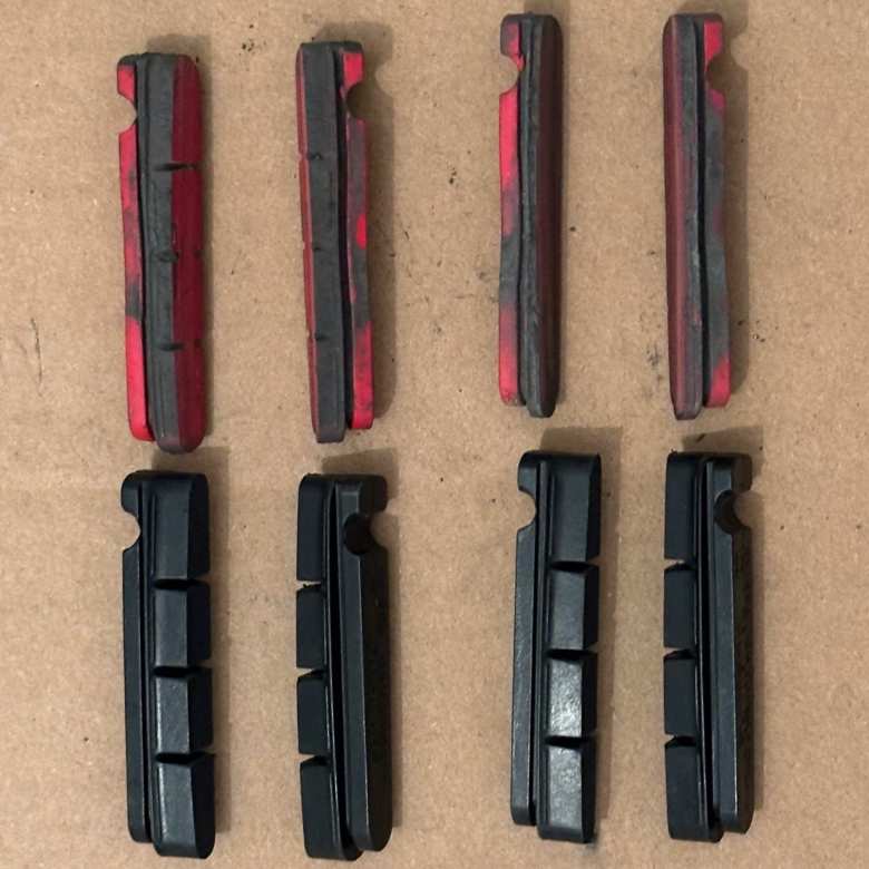 I replaced the red brake pads with Shimano R55C3 ones. The old rear brake pads (top right) were worn almost all the way through.