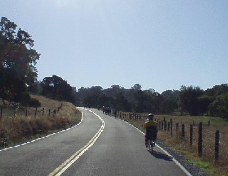 [Mile 25, 8:26 a.m.] A recumbent ahead in terrain that starts to get hilly.