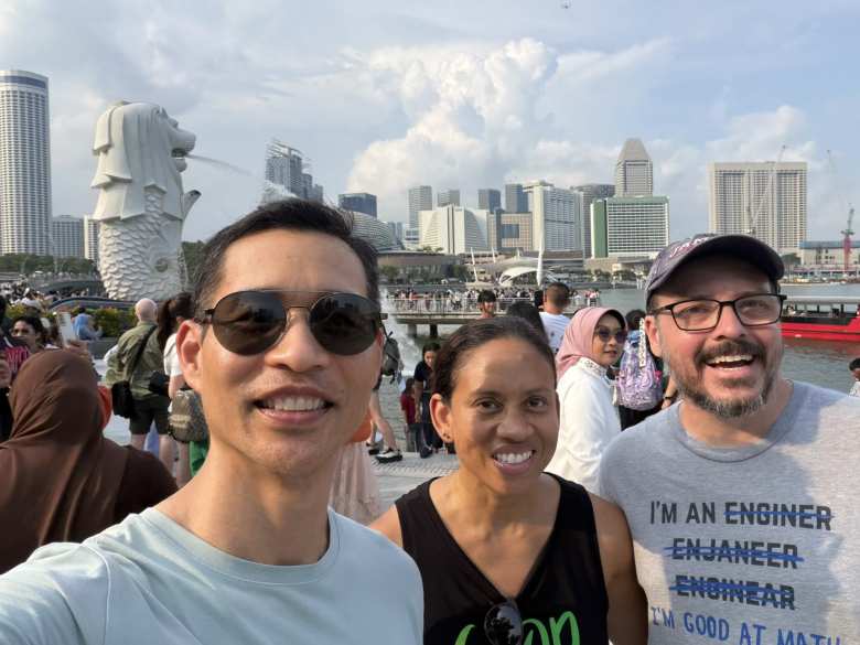 Felix, Leanne, and James in front of the Merlion.