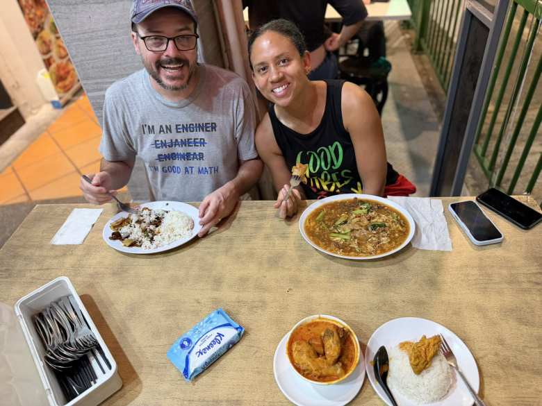 Eating dinner outside Feng Ji Chicken Rice. I had Curry Chicken & Rice, which cost less than SG$7.