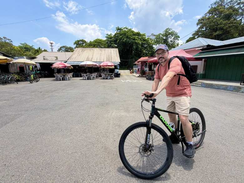James on a Goose rental mountain bike at Pulau Ubin.