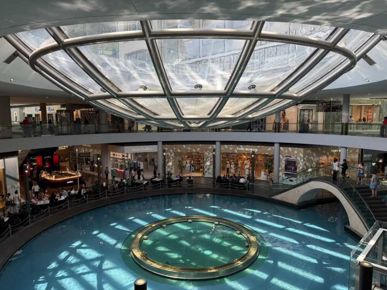 At The Shoppes at Marina Bay Sands, there was a "bowl with a hole" for the roof that artfully created a fountain.