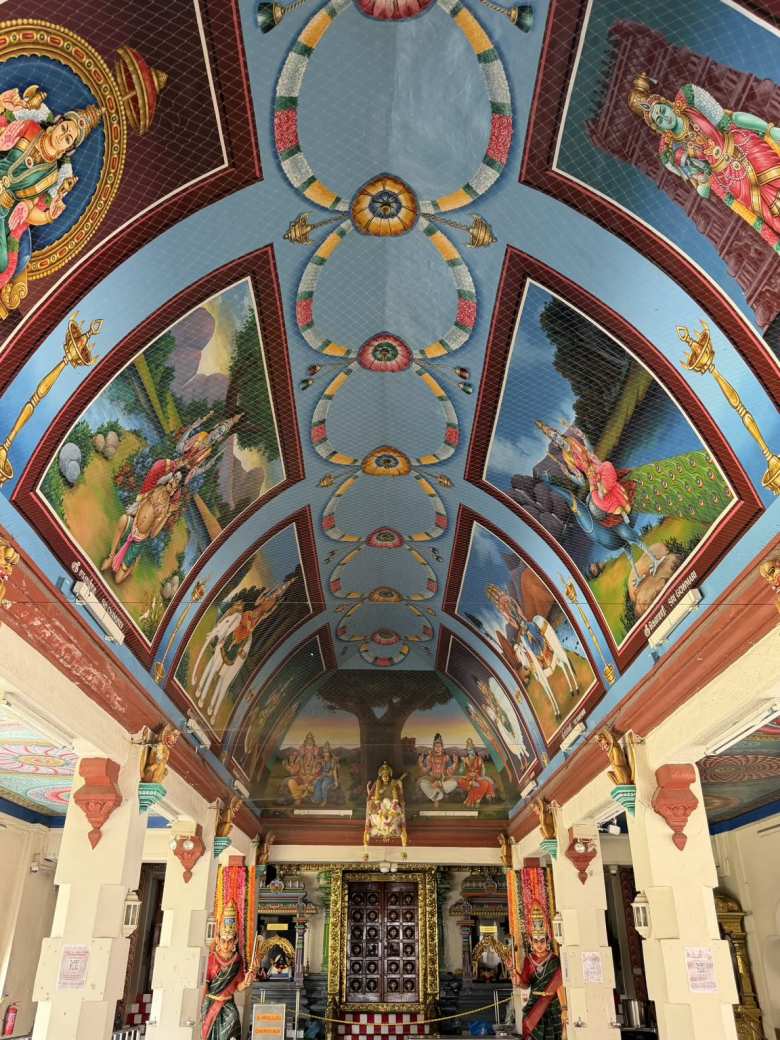 A ceiling featured exquisite, colorful artwork inside the Sri Merimman Temple.