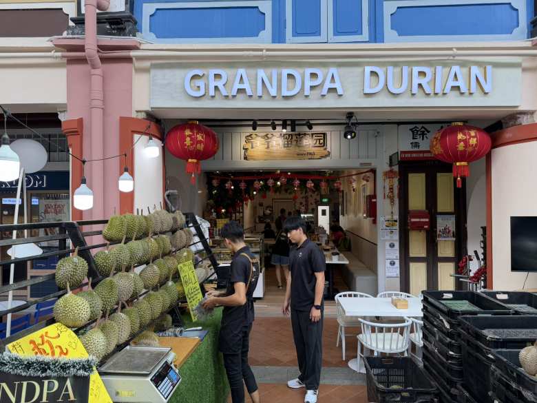 One could buy durian fruit at Grandpa Durian. However, there were signs inside trains, buses, and hotels saying that durian was not allowed. This is because durian smells bad.
