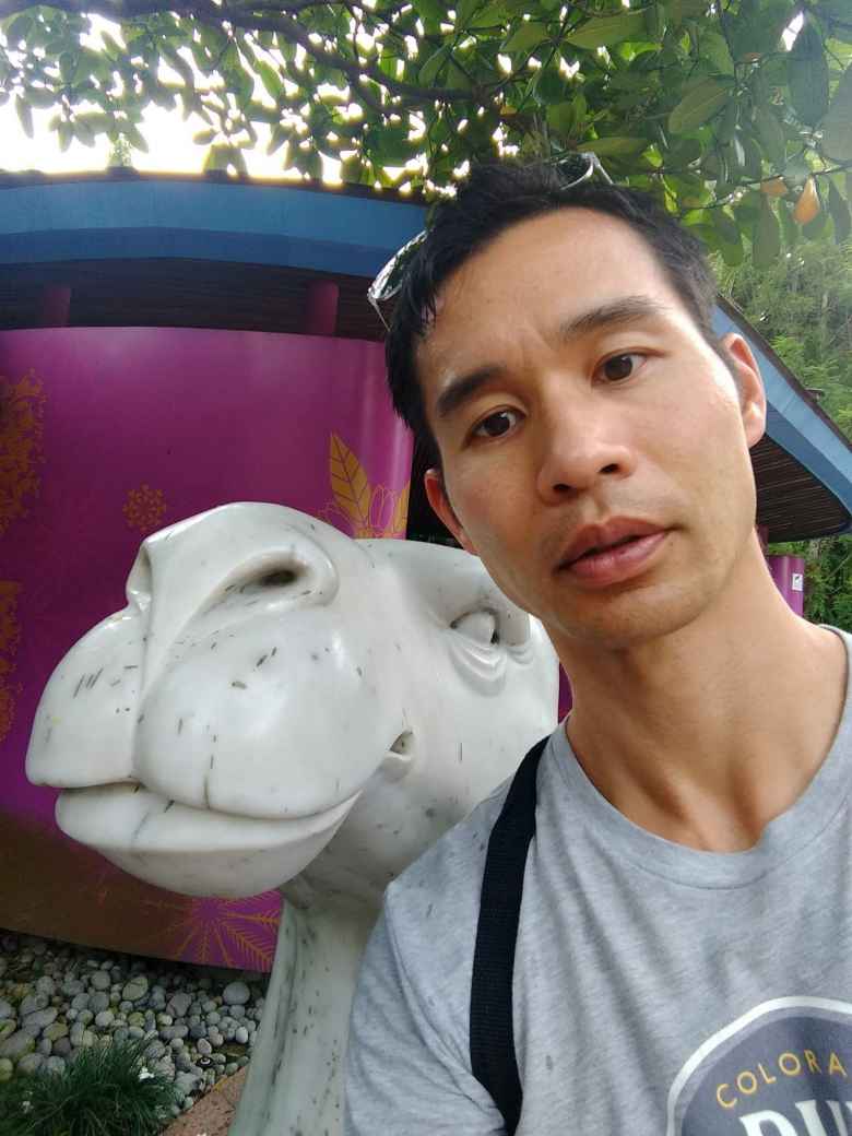 Me with a white camel statue at Gardens by the Bay in Singapore.